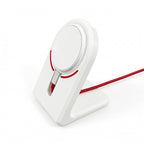 Angled view from the rear showing the OnePlus AirVOOC 50W Magnetic Charger and phone mounted on the stand, with the red cable extending backward.